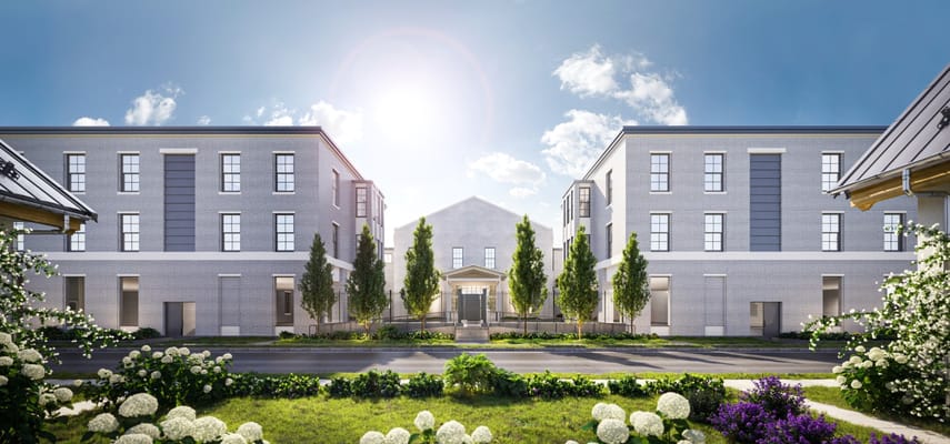 Exterior view of a senior living facility with landscaped gardens