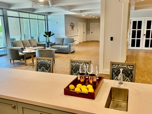 Brightly lit living area with comfortable seating and a view.