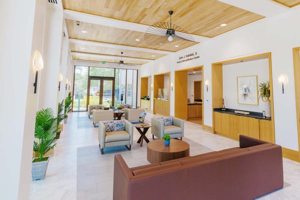 Bright and modern lobby with seating areas and plants