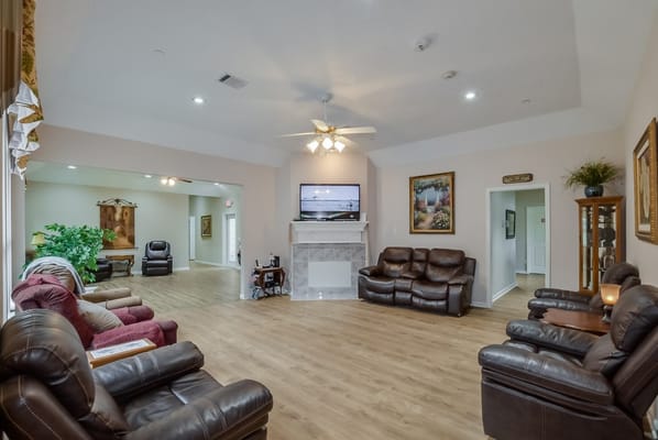 Comfortable living room area with seating and television.