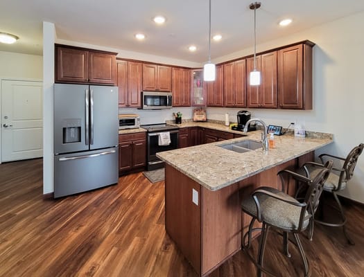 Modern kitchen with granite countertops and stainless steel appliances