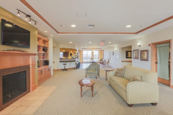 Cozy lounge area with seating and a fireplace