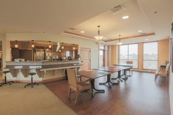 Bright dining area with tables and a service counter