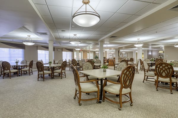 Bright dining room with tables and chairs arranged