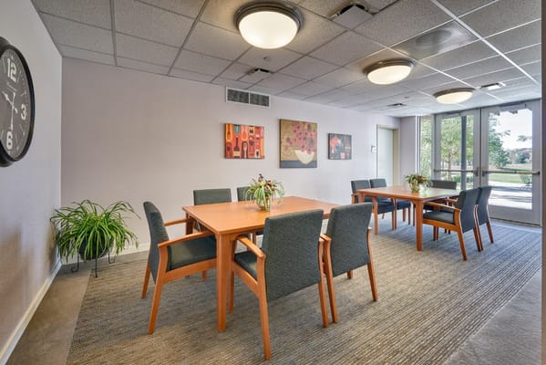 Bright common area with tables and chairs
