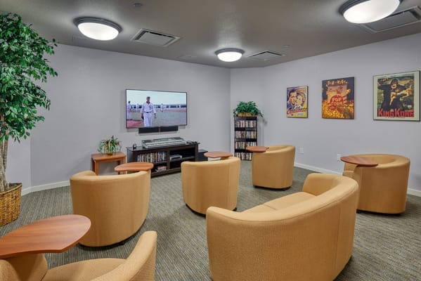 Common area with seating and a television
