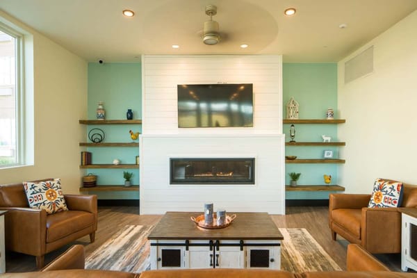 Comfortable seating and modern decor in the lounge of Karl's Farm Senior Apartments