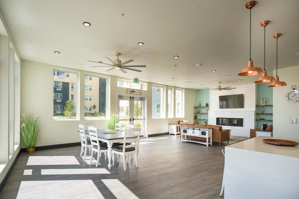 Bright and airy common lounge with a dining area and modern furnishings