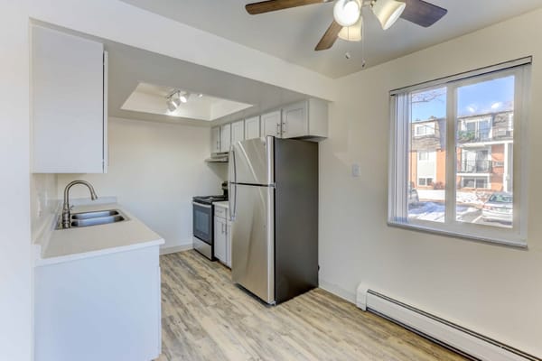 Bright kitchen with stainless steel appliances and large window