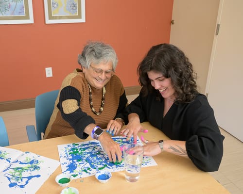 Residents engaging in a creative activity together