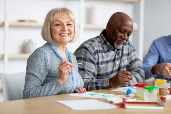 Residents engaged in a painting activity