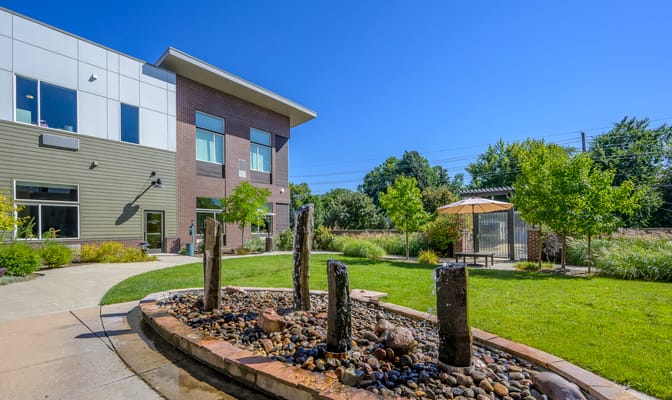 Outdoor space with a fountain and seating area