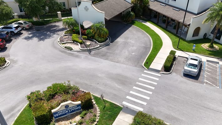 Aerial view of the entrance and driveway at Arbor Terrace Citrus Park.