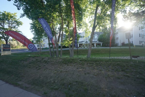 Exterior view of assisted living facility with banners