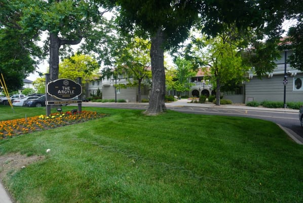 Sign for The Argyle senior living facility with landscaped area