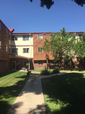 Exterior view of Broadview Apartments with landscaped pathway