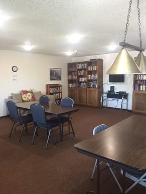 Common area with seating and bookshelves
