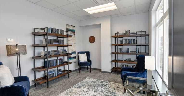 Cozy reading area with bookshelves and seating