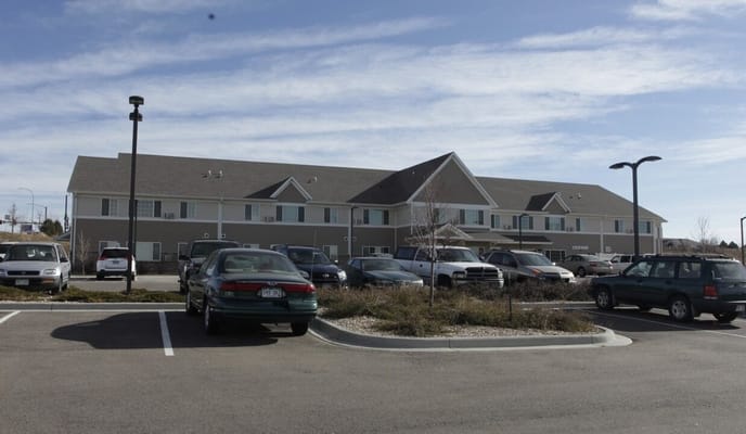 Exterior view of Fox Run Apartments with parking
