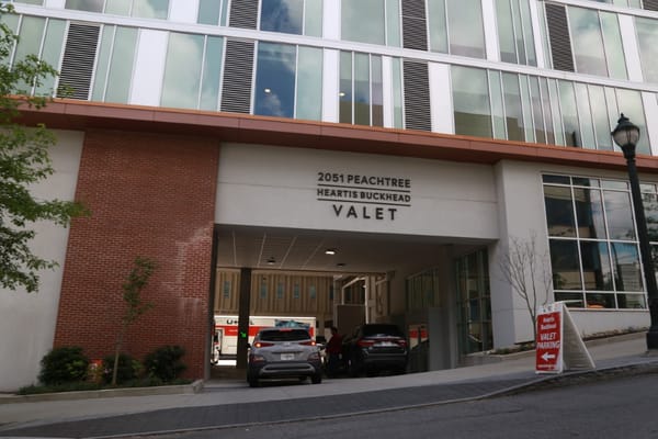 Entrance with signage for valet parking at Heartis Buckhead