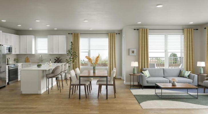 Bright kitchen and living room with dining table and modern furnishings.