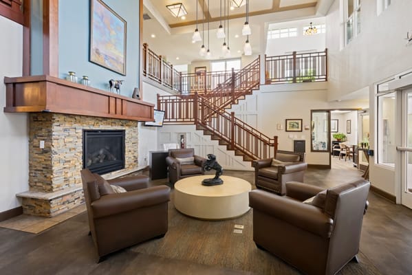Welcoming lobby with seating and a staircase.