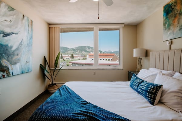 Comfortable bedroom with a view of mountains