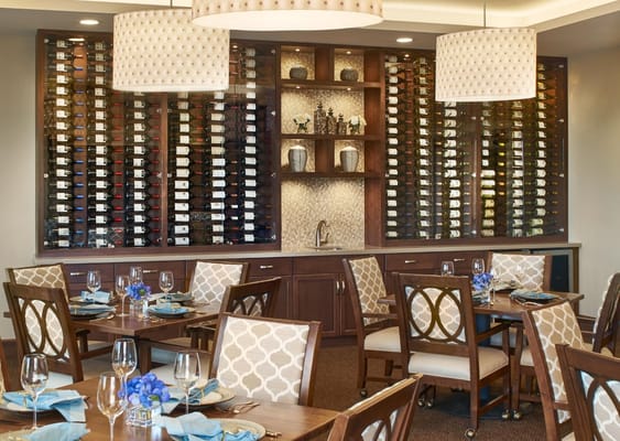 Elegant dining room setup with wine display