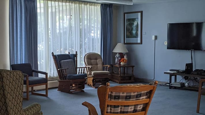 Bright living room with comfortable seating and a TV