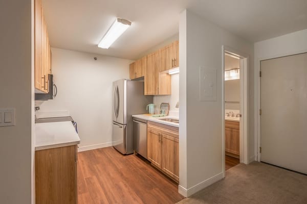 Interior view of a modern kitchen with stainless steel appliances