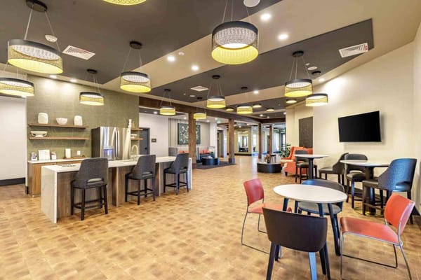 Spacious common area featuring modern decor and seating arrangements.