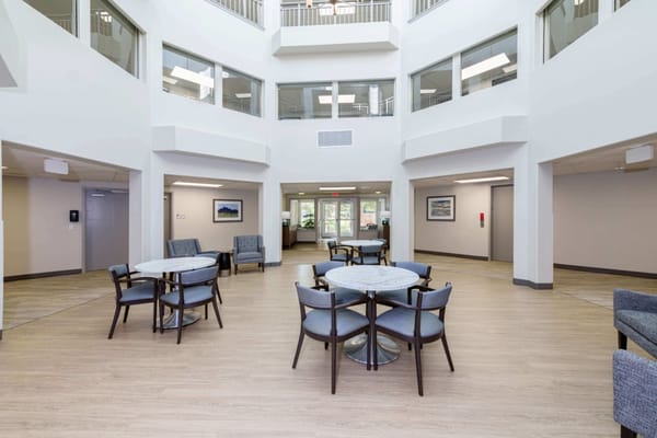 Bright common area with seating and tables