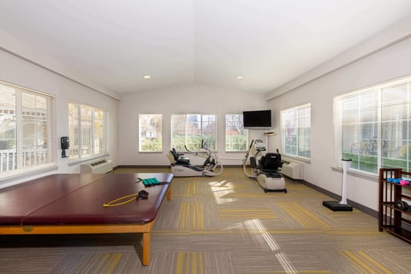 Interior view of a fitness area with exercise equipment