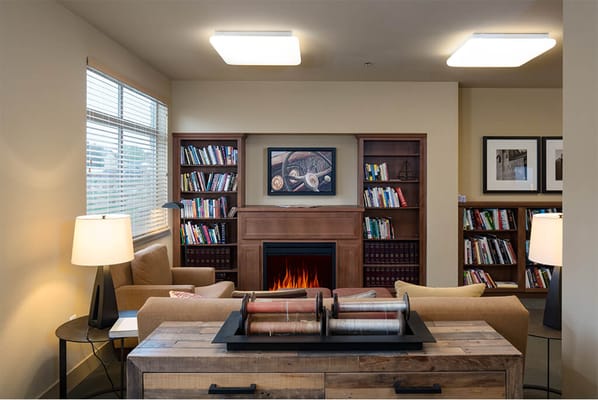 Cozy common area with bookshelves and seating