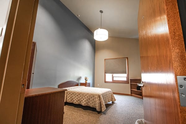 Private resident room with a bed and furniture