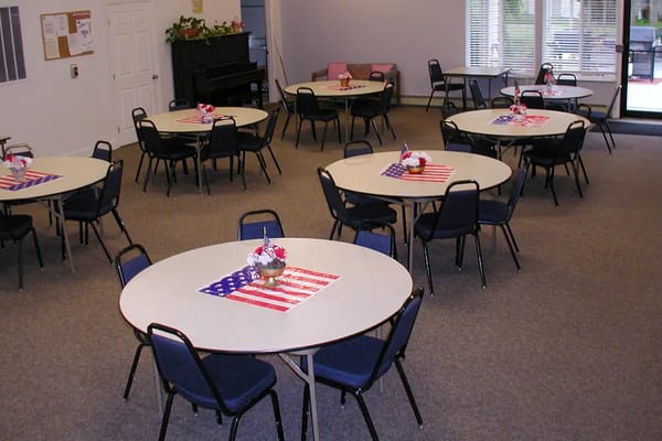 Interior common area setup for event with tables and decorations