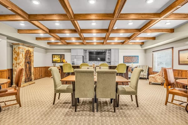 Spacious common area with seating and dining tables