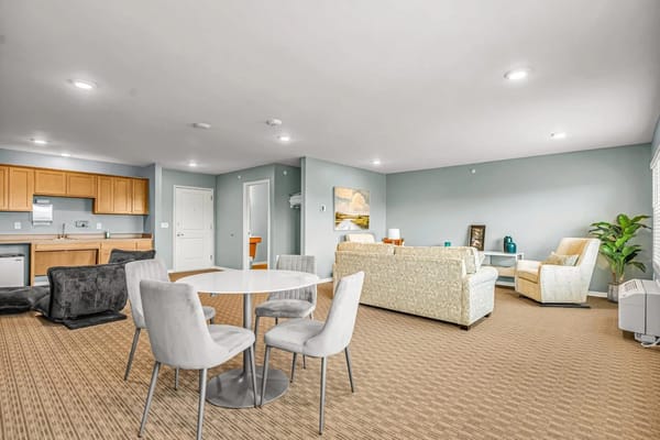 Bright and spacious living room with a dining area and kitchen