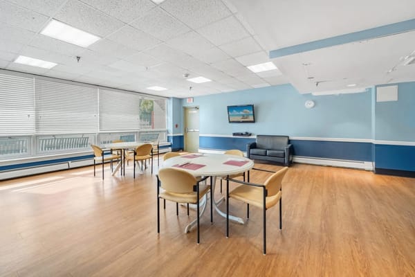 Bright common area with tables and chairs