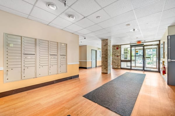 Interior view of a lobby with mailboxes and entrance