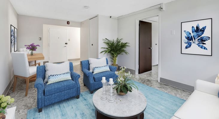 Cozy living room with blue chairs and a decorative table