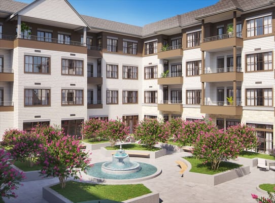 Outdoor courtyard with a fountain and landscaping