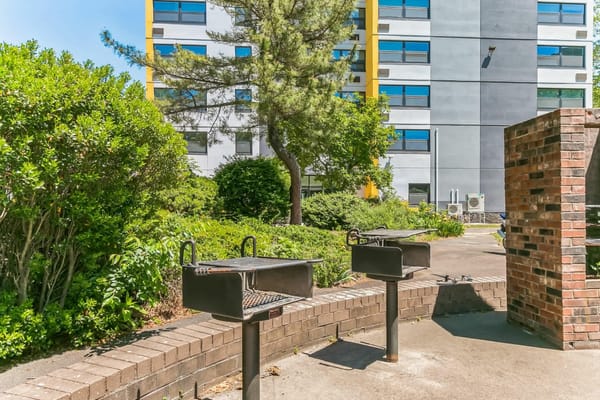 Outdoor grilling area with a view of the facility