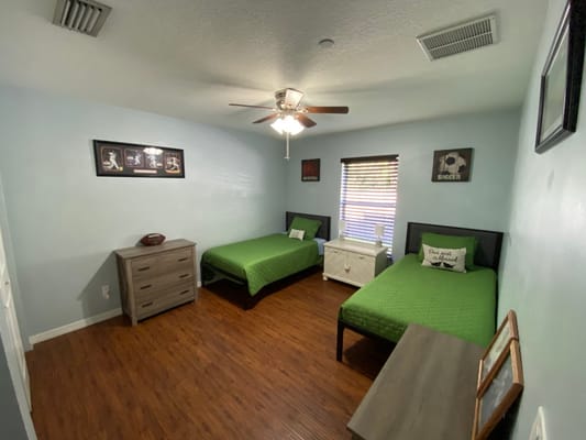 Private resident room with two beds and decor