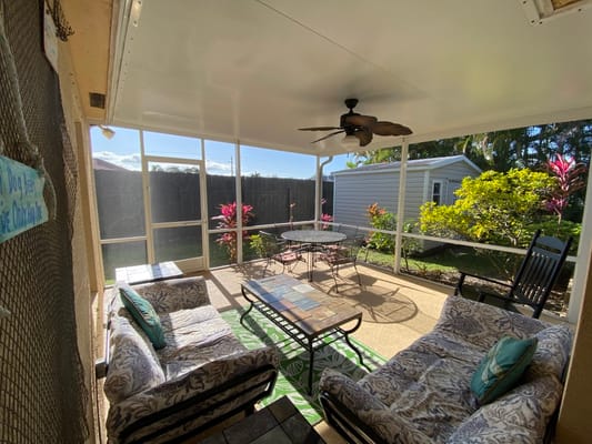 Outdoor seating area with tropical plants