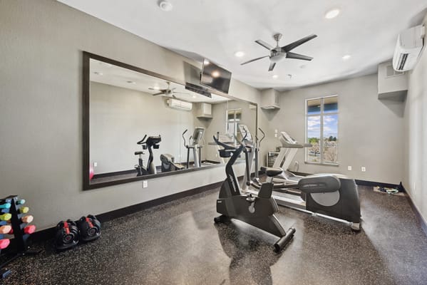 Interior view of a fitness room with exercise equipment