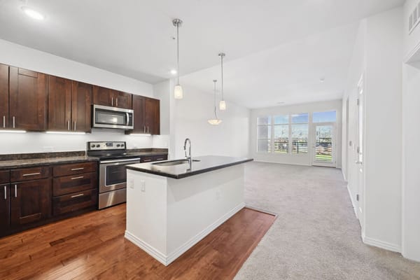Modern kitchen and living area in a senior living space