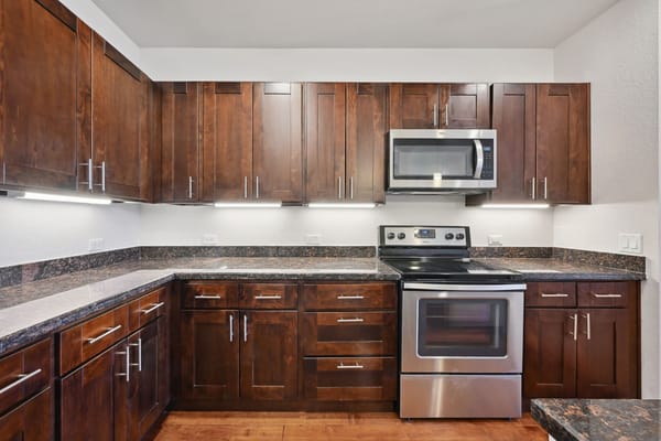 Interior of a kitchen with dark wood cabinets