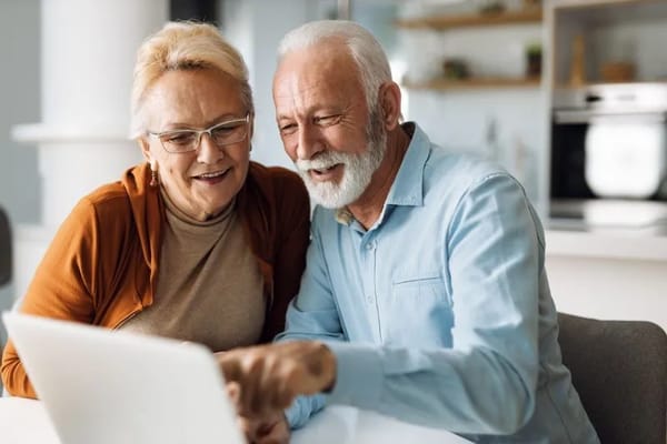 Senior couple using a laptop together