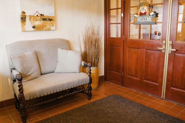 Cozy seating area with a welcome sign